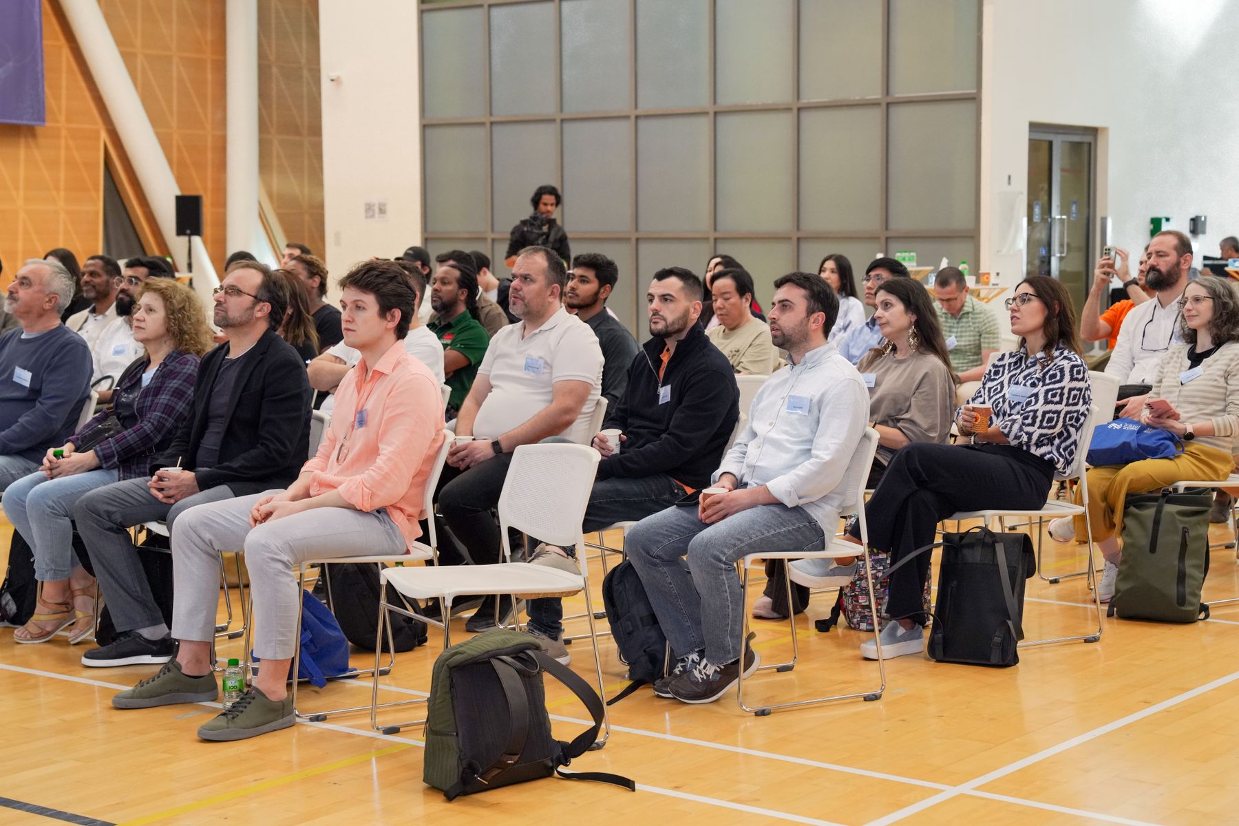 Professionals listening during a conference workshop