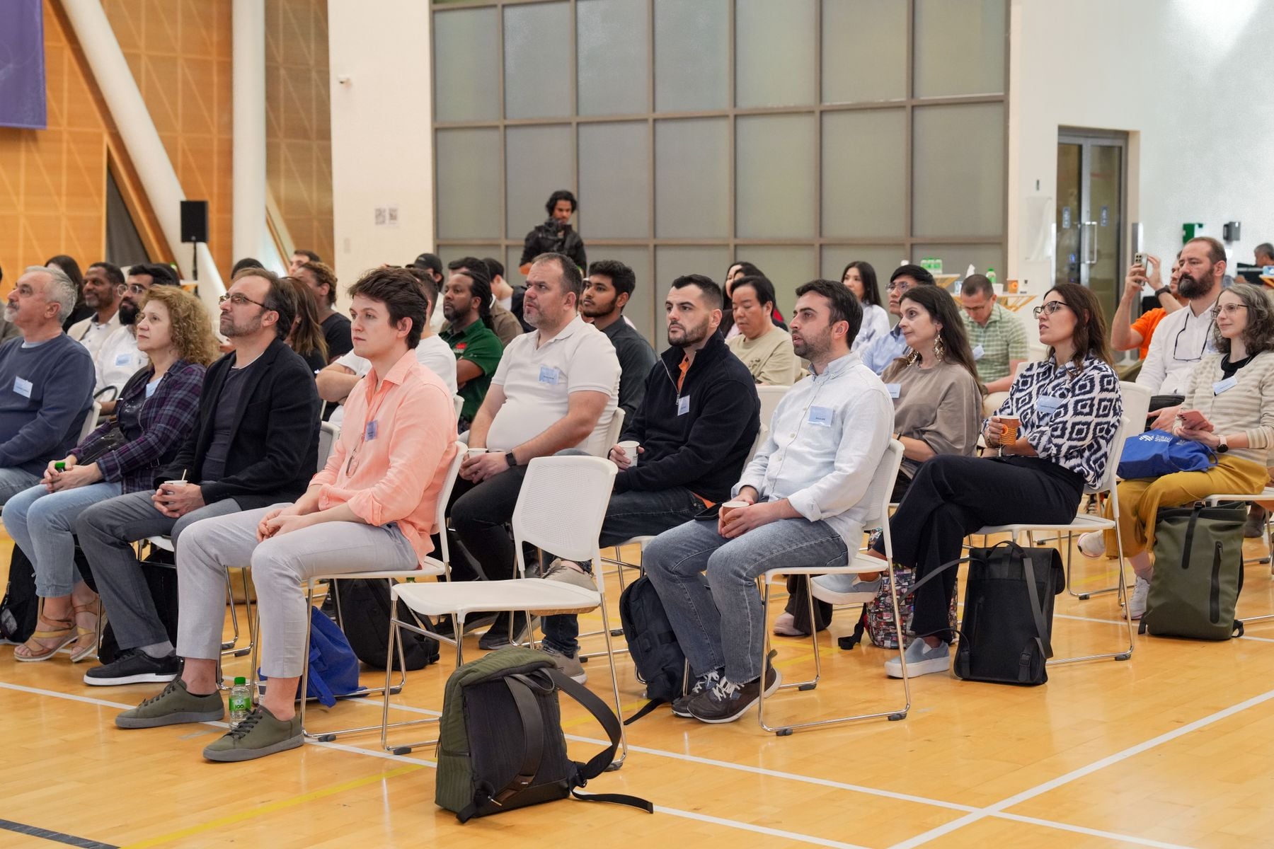 Professionals listening during a conference workshop