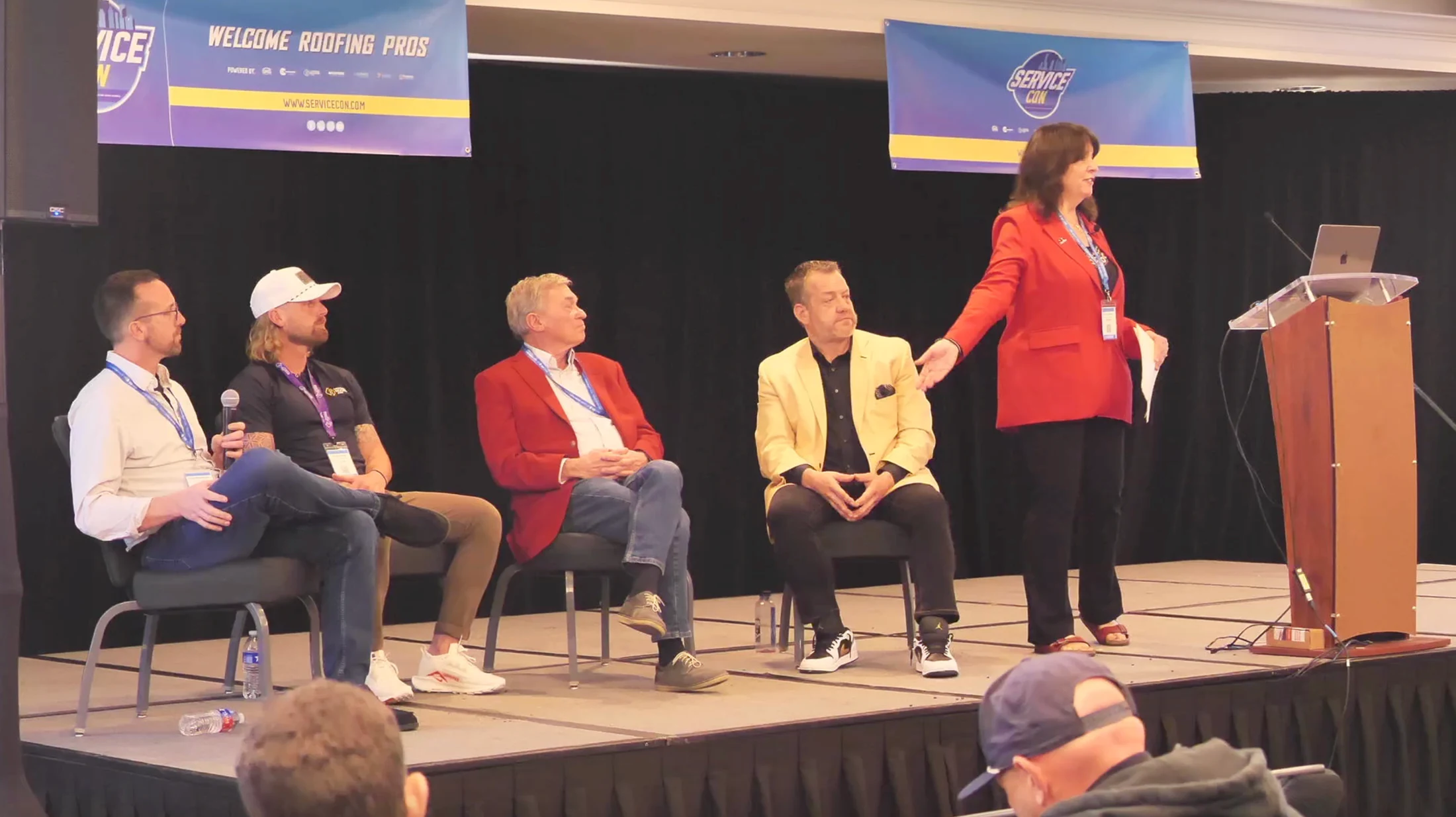 Five ServiceCon panelists discussing commercial roofing service