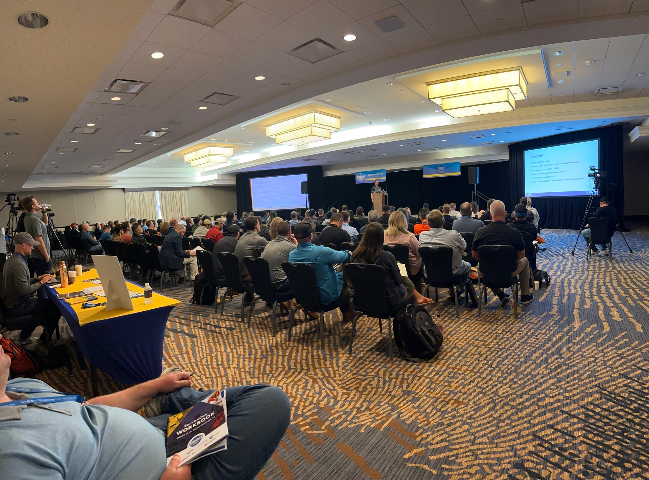 A full ServiceCon room during a live session